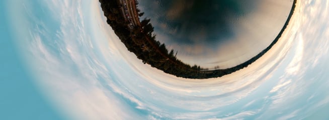 A fisheye lens photograph capturing a circular, distorted view of a landscape.